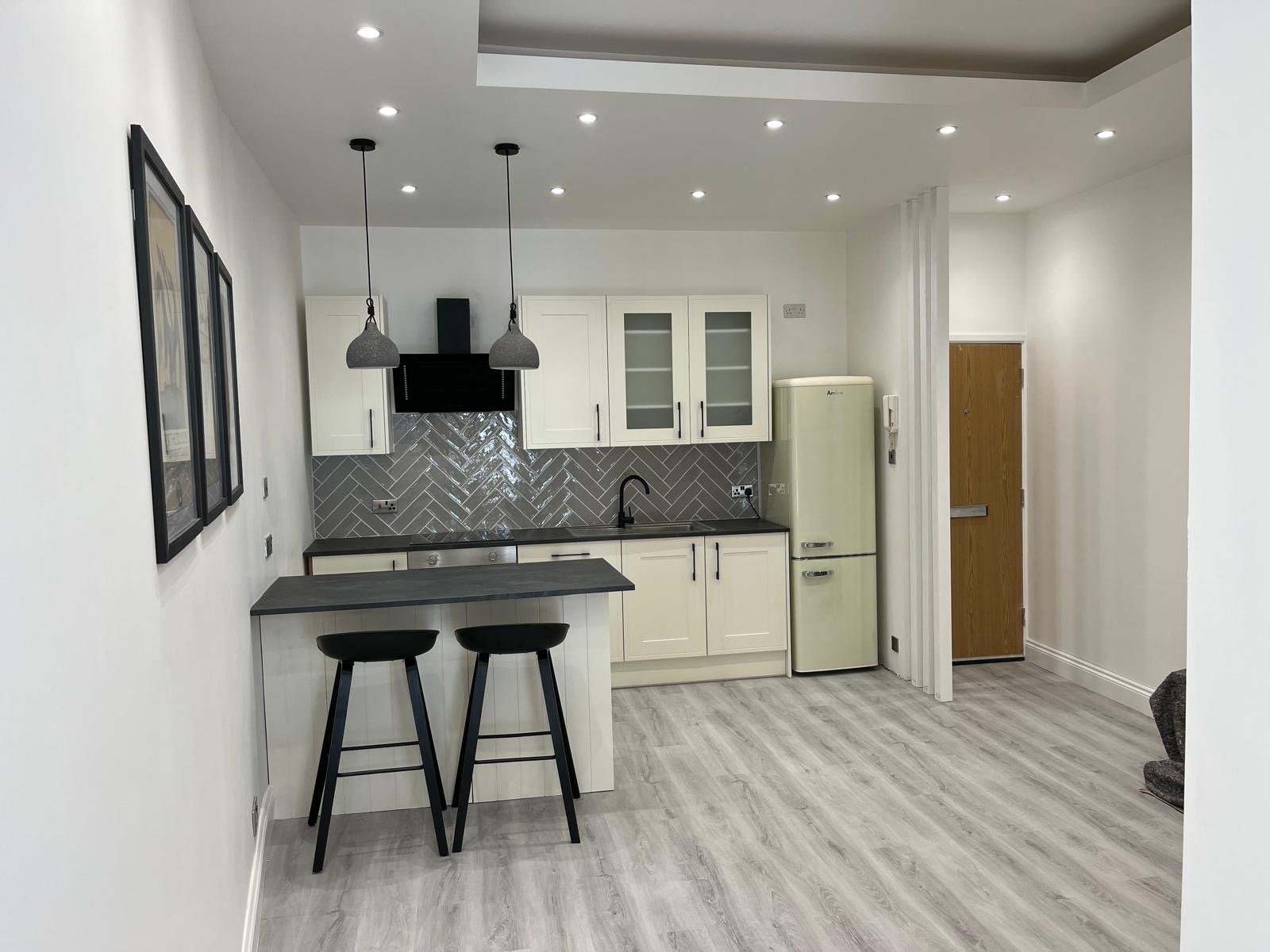 Completed modern open-plan kitchen in refurbished Bournemouth flat