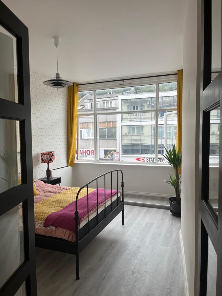 the redesigned bedroom combines a contemporary finish with plenty of natural light, creating a freehand inviting space. 